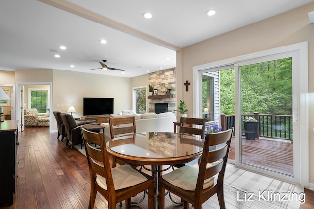 966 Timber Winds Dr SW, Grand Rapids, MI 49534 - dining area with a fireplace, recessed lighting, hardwood / wood-style floors, and a ceiling fan