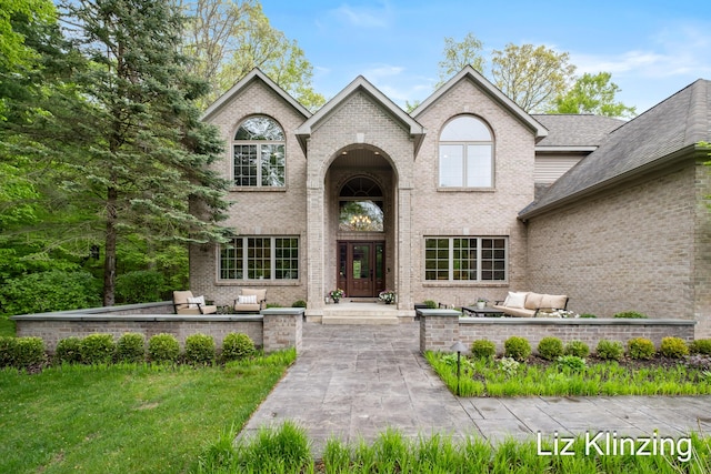 966 Timber Winds Dr SW, Grand Rapids, MI 49534 - view of front facade featuring brick siding and an outdoor living space