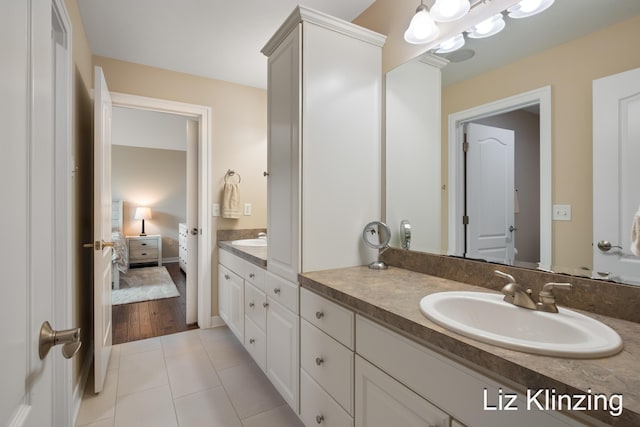 966 Timber Winds Dr SW, Grand Rapids, MI 49534 - ensuite bathroom with double vanity and tile patterned flooring