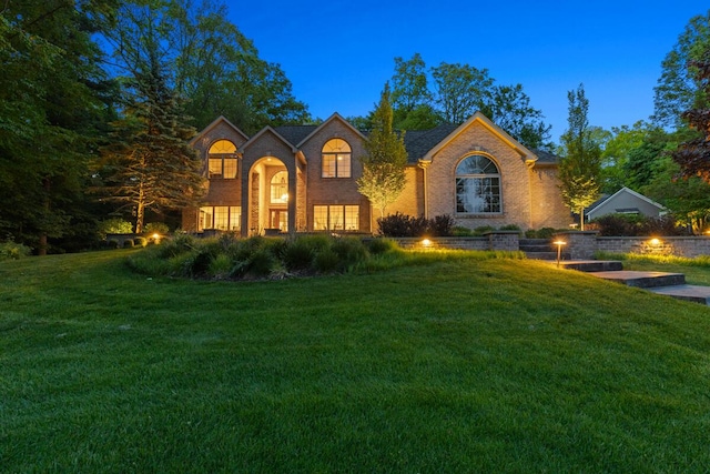966 Timber Winds Dr SW, Grand Rapids, MI 49534 - traditional-style home featuring a front lawn and brick siding