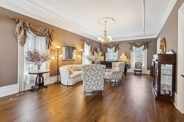 602 N Kalamazoo Ave, Marshall, MI 49068 - living room with a chandelier, crown molding, dark wood-type flooring, baseboards, and a fireplace