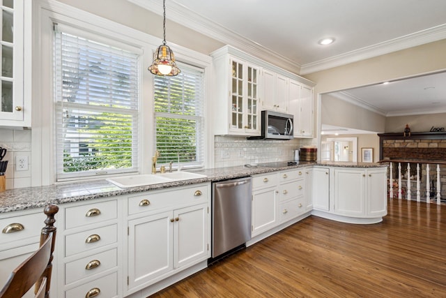 602 N Kalamazoo Ave, Marshall, MI 49068 - kitchen with stainless steel appliances, white cabinets, a peninsula, a sink, and dark wood-style flooring