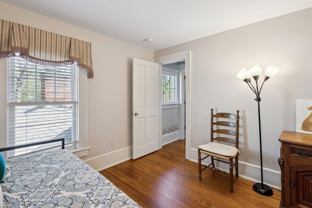 602 N Kalamazoo Ave, Marshall, MI 49068 - bedroom featuring wood finished floors and baseboards
