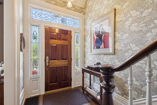 602 N Kalamazoo Ave, Marshall, MI 49068 - foyer with wallpapered walls and dark wood-style flooring