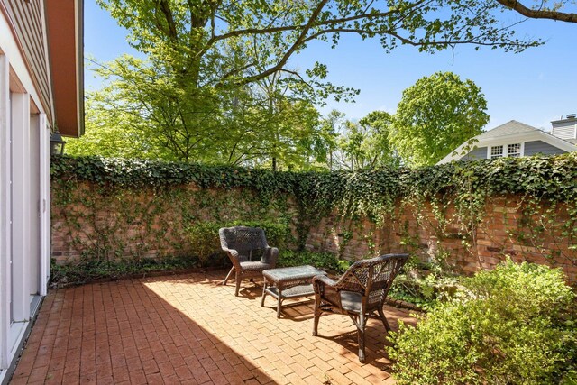 602 N Kalamazoo Ave, Marshall, MI 49068 - fenced backyard featuring a patio area
