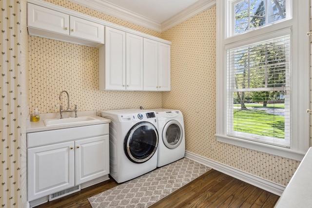 602 N Kalamazoo Ave, Marshall, MI 49068 - laundry area with crown molding, cabinet space, washer and dryer, baseboards, and dark wood finished floors