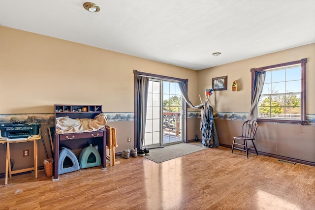 2495 Stitt Rd, Mio, MI 48647 - exercise room with wood finished floors, healthy amount of natural light, and baseboards