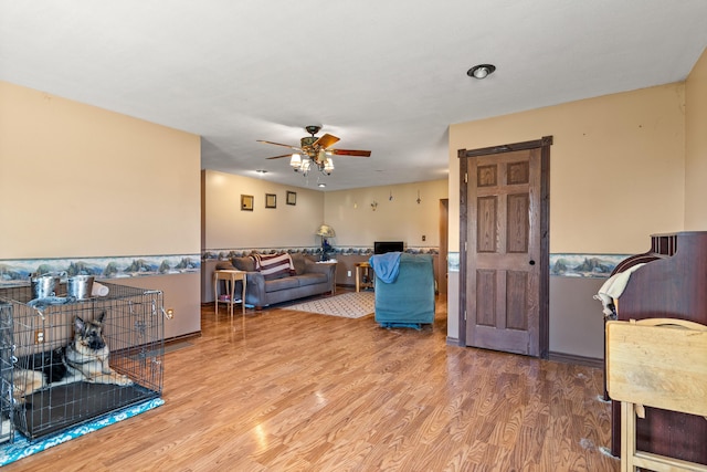 2495 Stitt Rd, Mio, MI 48647 - living room with ceiling fan and wood finished floors