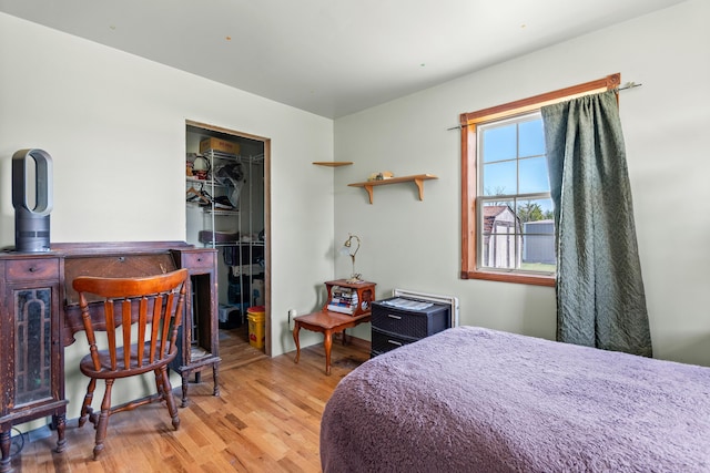 2495 Stitt Rd, Mio, MI 48647 - bedroom with wood finished floors, a walk in closet, and a closet