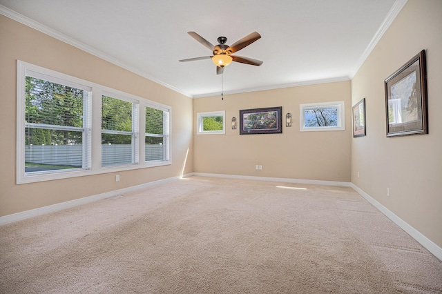 2380 Avalon Woods Dr, Portage, MI 49024 - empty room featuring ornamental molding, a ceiling fan, light colored carpet, and baseboards