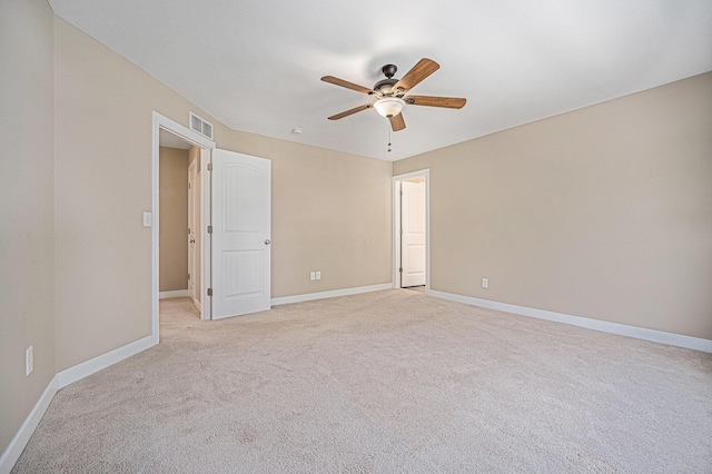 2380 Avalon Woods Dr, Portage, MI 49024 - empty room featuring a ceiling fan, light colored carpet, and baseboards