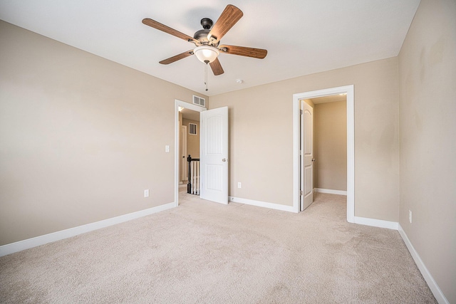 2380 Avalon Woods Dr, Portage, MI 49024 - unfurnished bedroom with light colored carpet, baseboards, and a ceiling fan