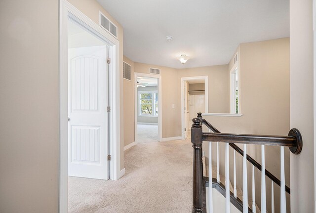 2380 Avalon Woods Dr, Portage, MI 49024 - hall with an upstairs landing, carpet flooring, and baseboards