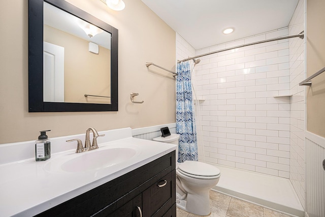 2380 Avalon Woods Dr, Portage, MI 49024 - full bathroom featuring toilet, vanity, a tile shower, and a wainscoted wall