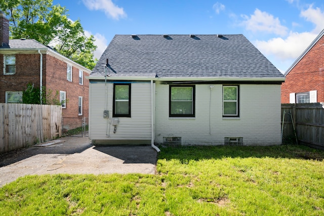 11642 Laing St, Detroit, MI 48224 - back of property with roof with shingles, brick siding, and a patio
