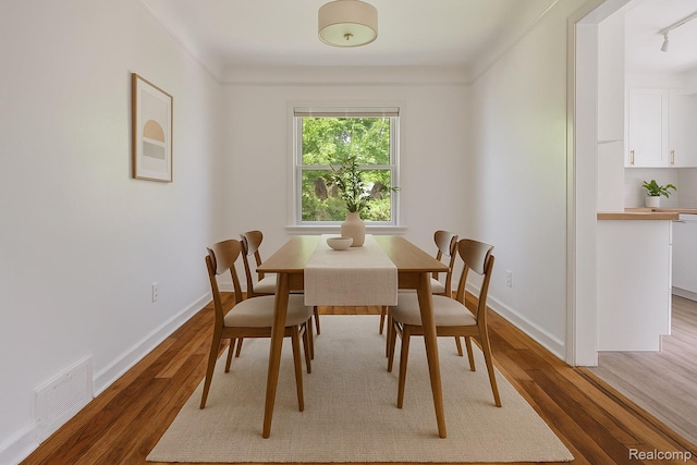 11642 Laing St, Detroit, MI 48224 - dining area with light wood-style flooring and baseboards