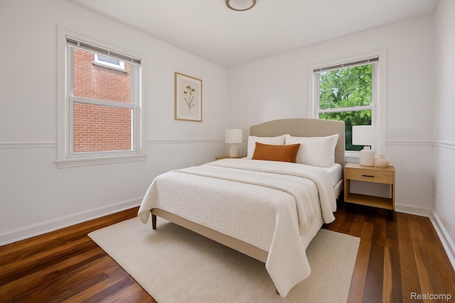 11642 Laing St, Detroit, MI 48224 - bedroom featuring dark wood-style flooring and baseboards
