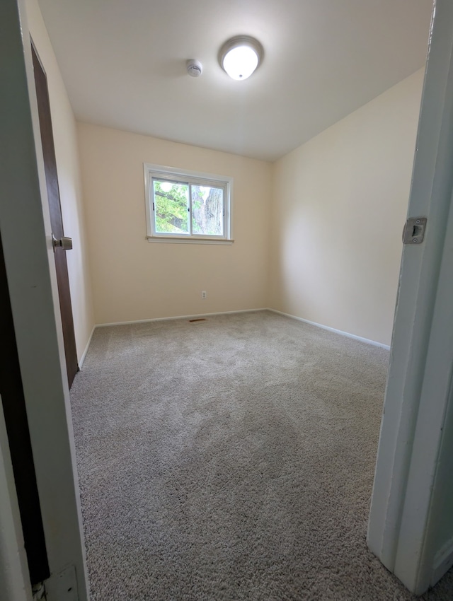 1210 Red Leaf Ln, Ypsilanti, MI 48198 - spare room featuring a smoke detector, carpet floors, and baseboards