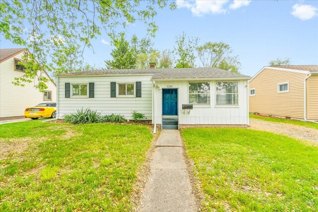 1210 Red Leaf Ln, Ypsilanti, MI 48198 - view of front facade with a front lawn and a chimney