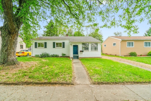 1210 Red Leaf Ln, Ypsilanti, MI 48198 - view of front of home with a chimney and a front lawn