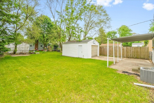 1210 Red Leaf Ln, Ypsilanti, MI 48198 - view of yard featuring a patio, a detached garage, and cooling unit