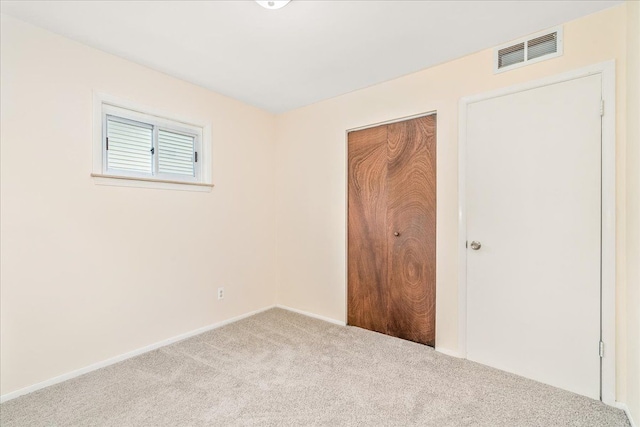 1210 Red Leaf Ln, Ypsilanti, MI 48198 - unfurnished bedroom featuring carpet flooring, a closet, and baseboards