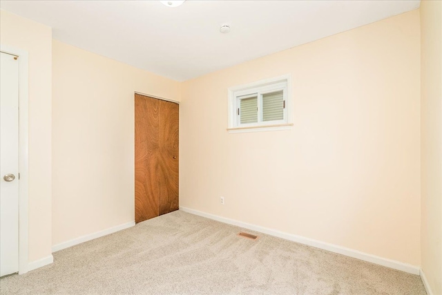1210 Red Leaf Ln, Ypsilanti, MI 48198 - unfurnished bedroom with carpet floors, baseboards, and a closet