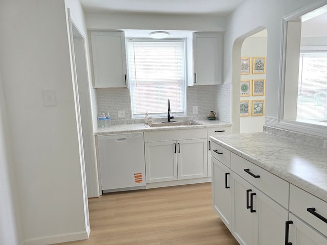 15360 Collinson Ave, Eastpointe, MI 48021 - kitchen with dishwasher, a sink, tasteful backsplash, and arched walkways