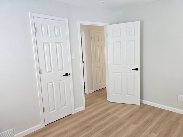 15360 Collinson Ave, Eastpointe, MI 48021 - unfurnished bedroom featuring light wood-style floors and baseboards