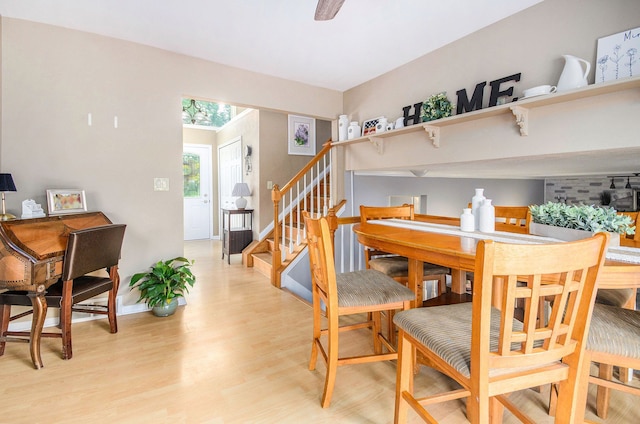 3488 Hilton Estates Dr, Brighton, MI 48114 - dining room with light wood-style flooring, stairs, and baseboards