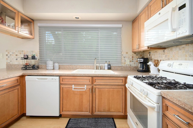 3488 Hilton Estates Dr, Brighton, MI 48114 - kitchen with white appliances, a sink, tasteful backsplash, light countertops, and glass insert cabinets