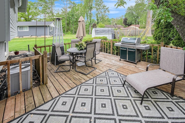 3488 Hilton Estates Dr, Brighton, MI 48114 - wooden terrace with a grill, outdoor dining area, and a lawn