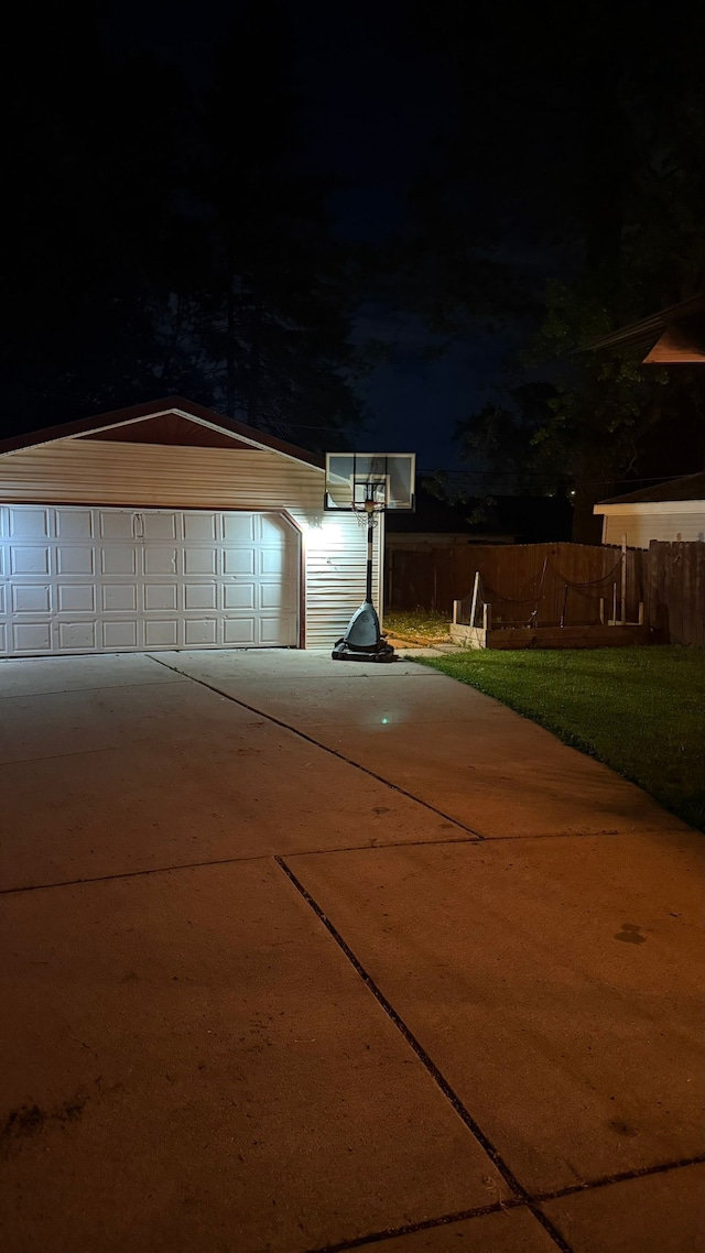 4425 Westpoint St, Dearborn Heights, MI 48125 - garage at twilight featuring fence