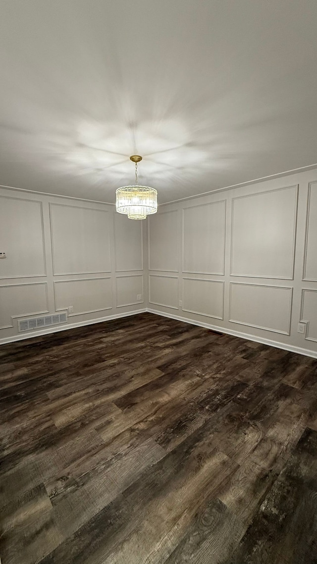4425 Westpoint St, Dearborn Heights, MI 48125 - unfurnished dining area featuring a decorative wall, dark wood-style floors, and a chandelier