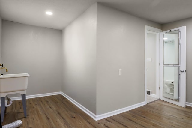 202 Haltiner St, River Rouge, MI 48218 - washroom with wood finished floors, baseboards, and recessed lighting