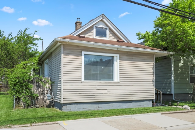 202 Haltiner St, River Rouge, MI 48218 - view of property exterior with a chimney and a lawn