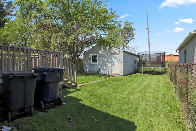 202 Haltiner St, River Rouge, MI 48218 - view of yard featuring a trampoline and an outbuilding