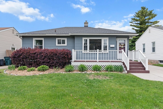 view of front of home with a chimney, a front lawn, a wooden deck, and central AC unit