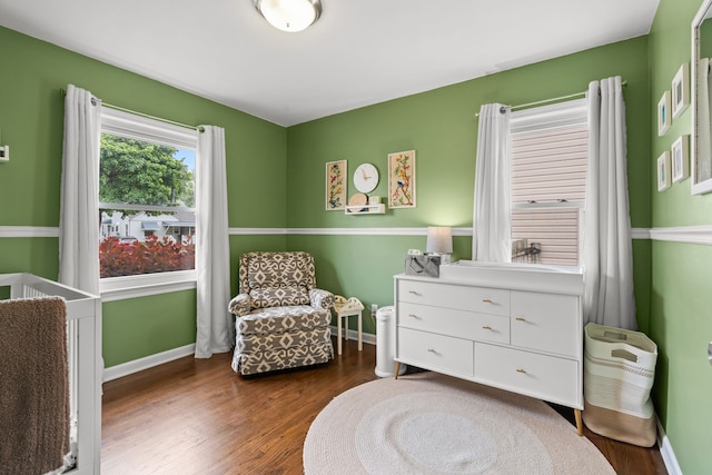 sitting room with wood finished floors and baseboards