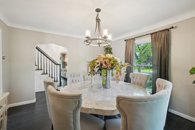 441 Roland Rd, Grosse Pointe Farms, MI 48236 - dining room with arched walkways, a chandelier, baseboards, and dark wood-type flooring