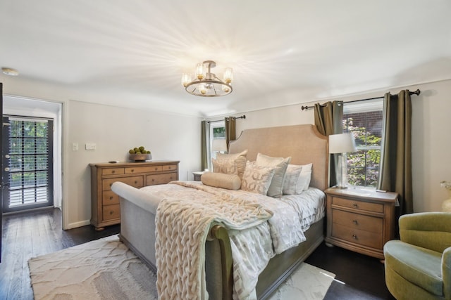 441 Roland Rd, Grosse Pointe Farms, MI 48236 - bedroom with a chandelier, dark wood finished floors, and access to outside