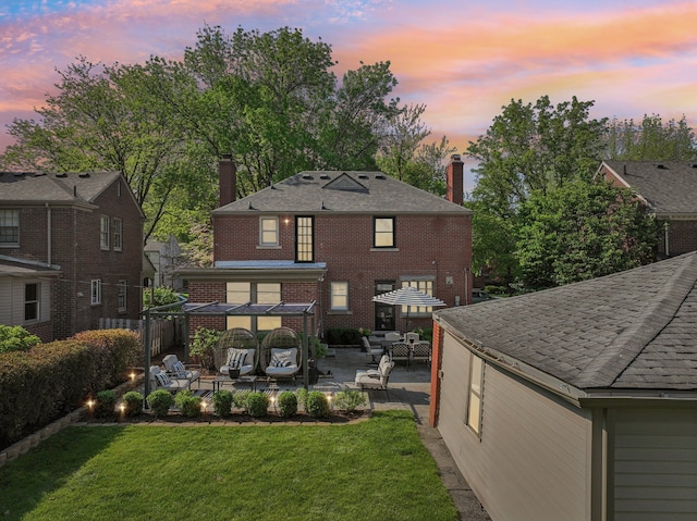 441 Roland Rd, Grosse Pointe Farms, MI 48236 - rear view of house featuring a chimney, an outdoor living space, a patio, and brick siding