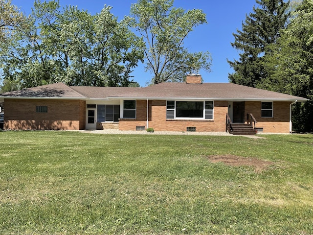 1648 Columbus Ave, Benton Harbor, MI 49022 - ranch-style home with brick siding, a chimney, a front lawn, and roof with shingles