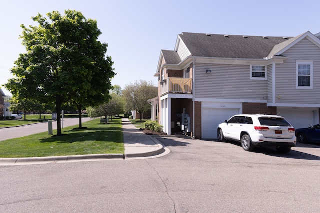46265 Cavalier Dr, Macomb, MI 48044 - view of asphalt street featuring curbs