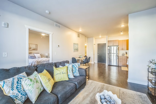 630 S Garfield Ave Unit 107, Traverse City, MI 49686 - living room featuring dark wood finished floors and baseboards