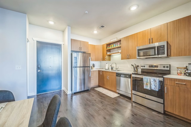 630 S Garfield Ave Unit 107, Traverse City, MI 49686 - kitchen with appliances with stainless steel finishes, open shelves, a sink, dark wood-style floors, and recessed lighting