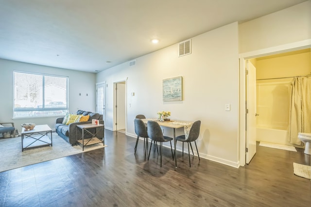 630 S Garfield Ave Unit 107, Traverse City, MI 49686 - dining area with dark wood-type flooring, baseboards, and recessed lighting