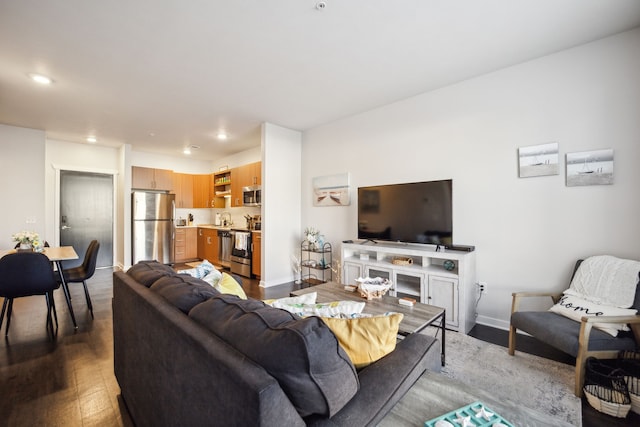 630 S Garfield Ave Unit 107, Traverse City, MI 49686 - living area with recessed lighting, wood finished floors, and baseboards
