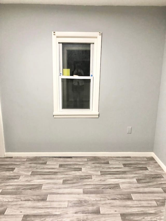 4127 Coggins Ave, Flint, MI 48506 - spare room featuring wood finished floors and baseboards