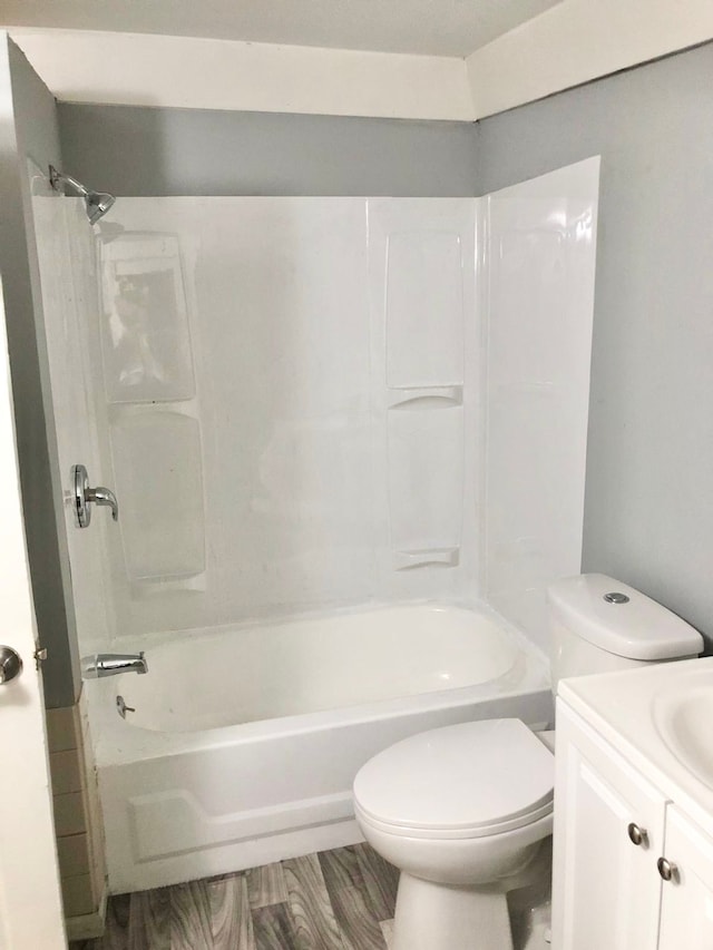 4127 Coggins Ave, Flint, MI 48506 - full bathroom with toilet, vanity, and bathing tub / shower combination